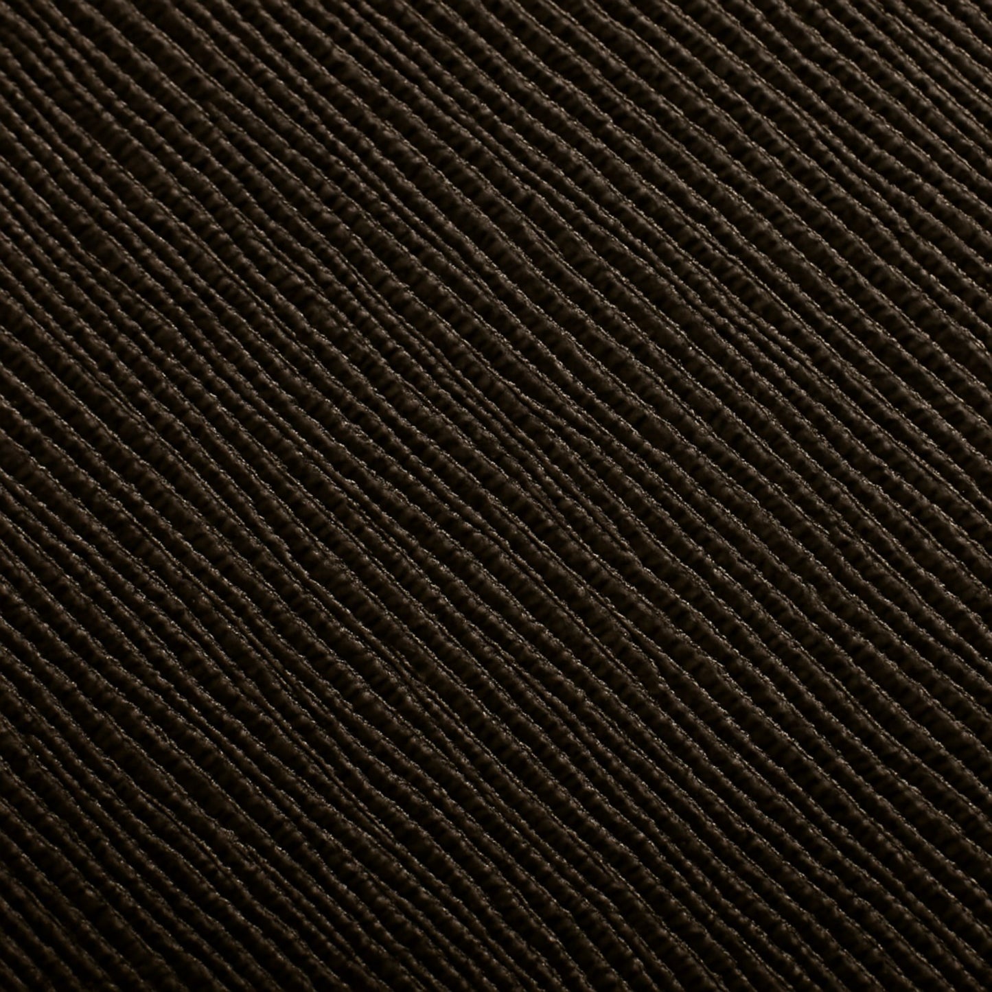 Macro detail of the Zaira bag’s espresso deep brown Italian leather grain.
