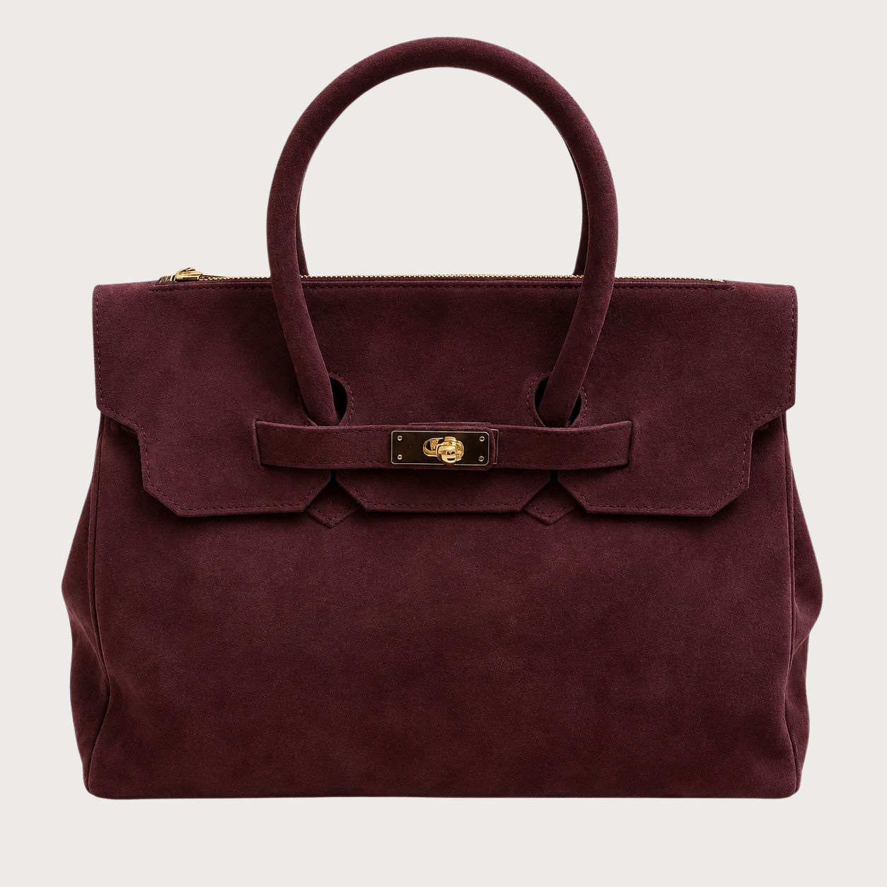Burgundy suede structured carryall tote with gold turn-lock hardware on a soft neutral studio background.