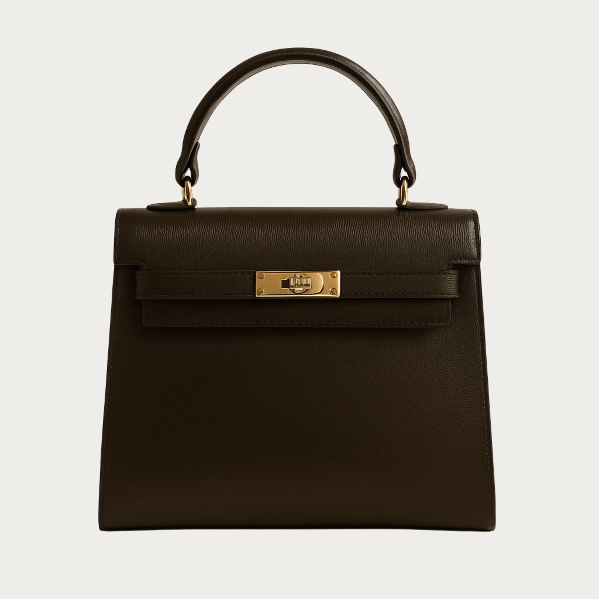 Zaira structured top-handle handbag in dark brown Italian leather with gold hardware, part of the Milano Muse Collection.