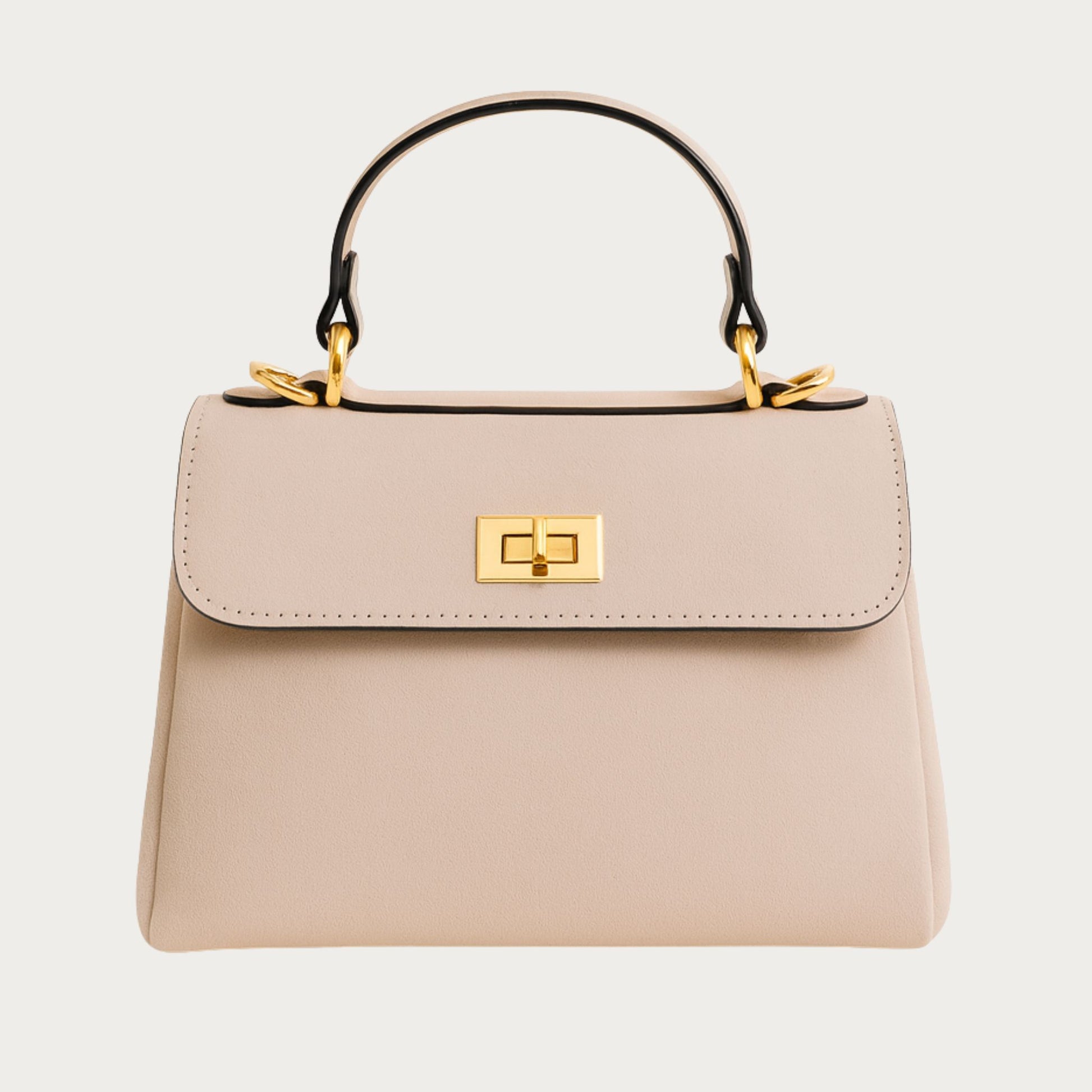 Mimi structured top-handle bag in powder pink Italian suede with gold hardware, front view.