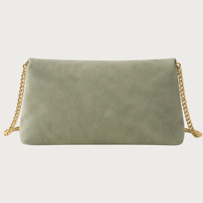 Back view of the Nina convertible clutch in muted sage-green suede with gold chain strap.