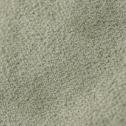 Macro texture detail of the Nina convertible clutch in muted sage-green suede.
