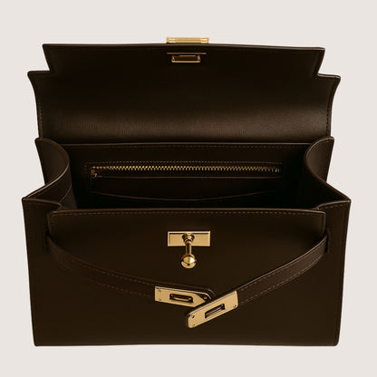 Interior view of the Zaira structured top-handle bag in espresso deep brown leather, showing the zip pocket and gold hardware.