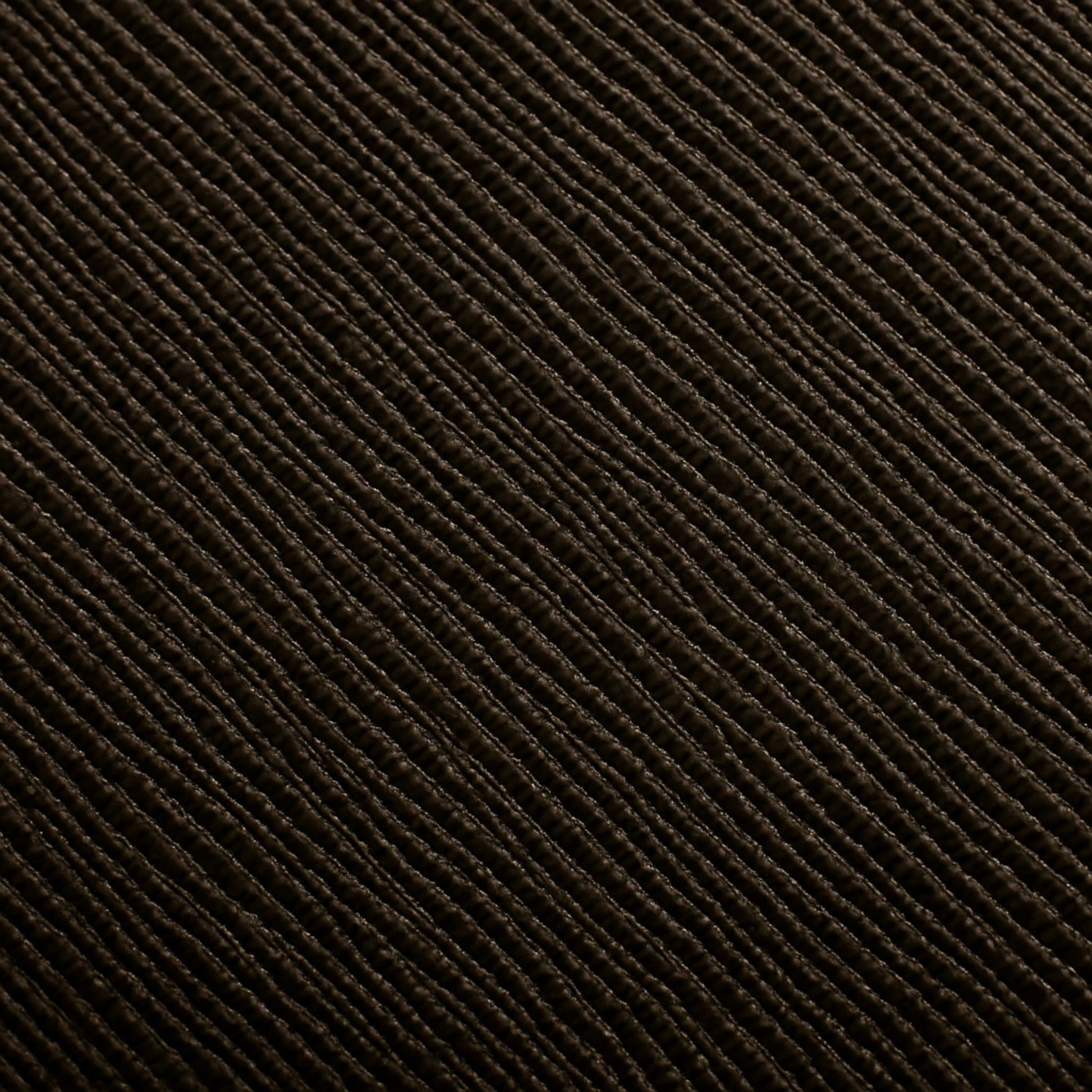 Macro detail of the Zaira bag’s espresso deep brown Italian leather grain.